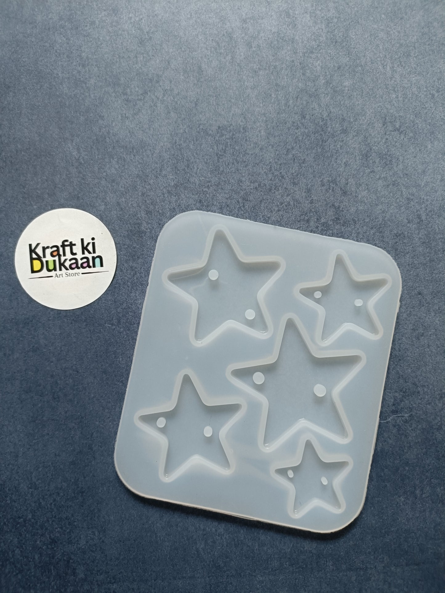 5-cavity star rakhi mould with five raised star cavities in a square silicone tray
