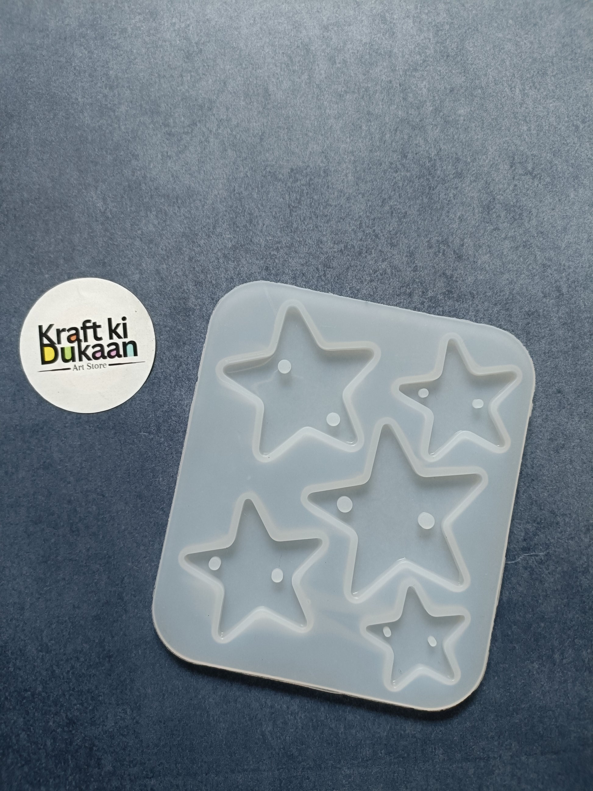 5-cavity star rakhi mould with five raised star cavities in a square silicone tray
