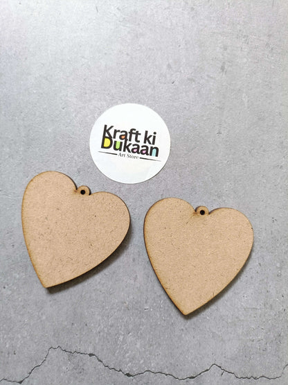 Heart-shaped MDF cutouts, tan brown, two pieces with small hanging hole.
