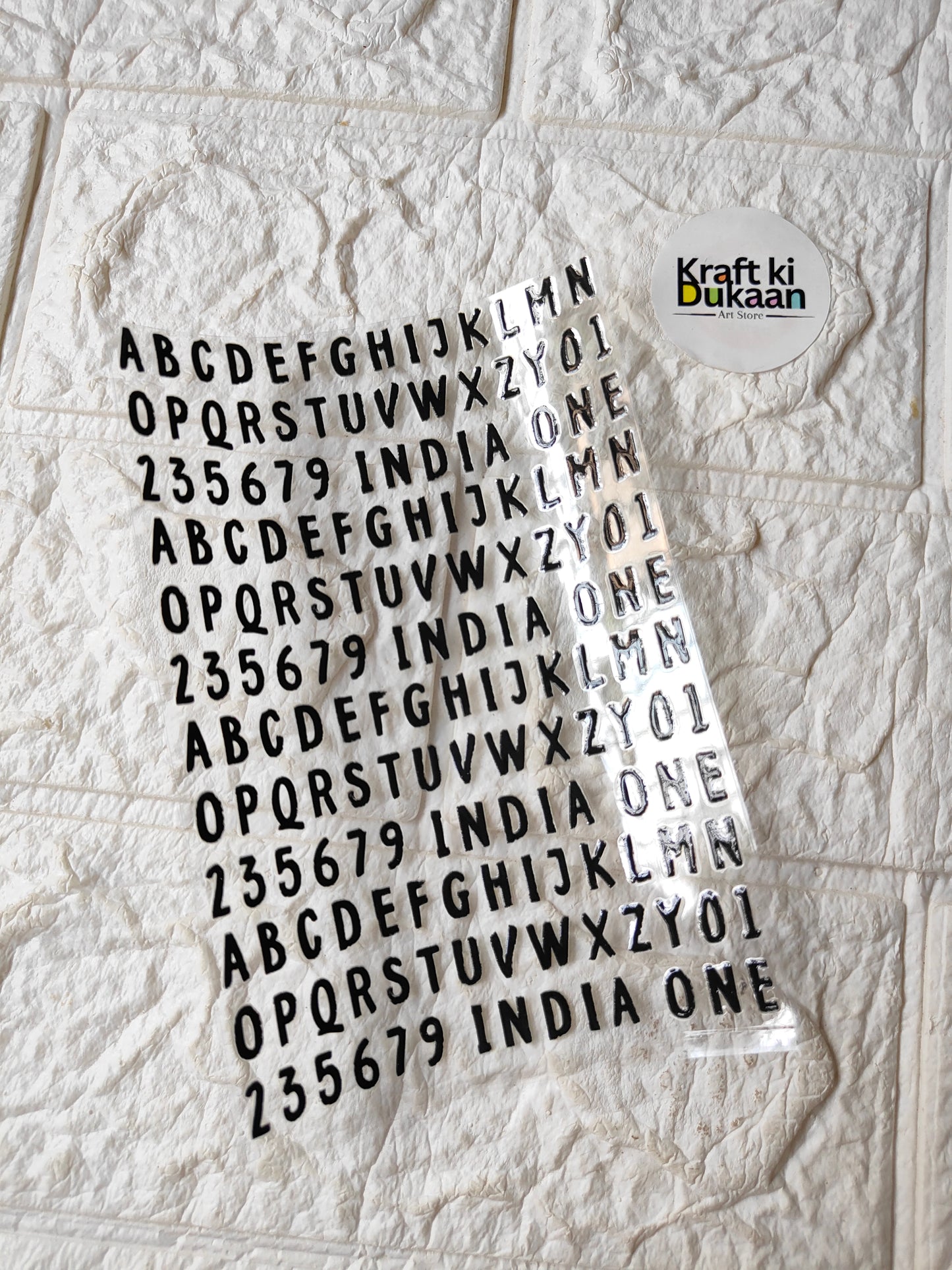 UV DTF peel-off sticker sheet J140, alphabet/number set with Kraft ki Dukaan logo