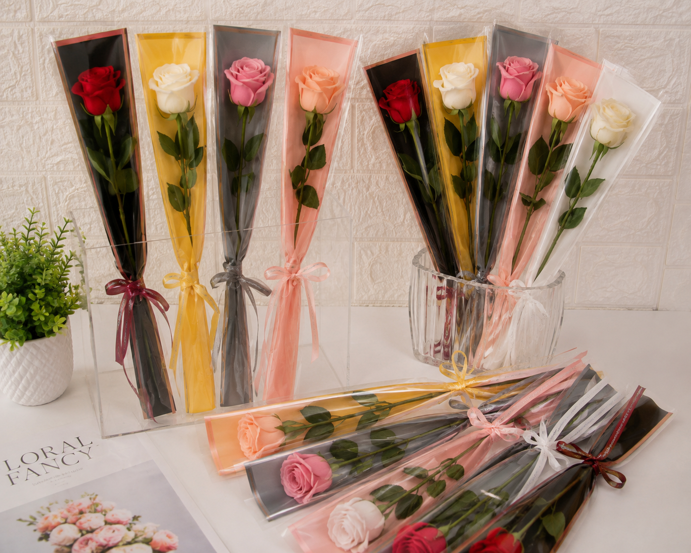 Assorted flower cover wraps with rose bouquets, tied with ribbon bows