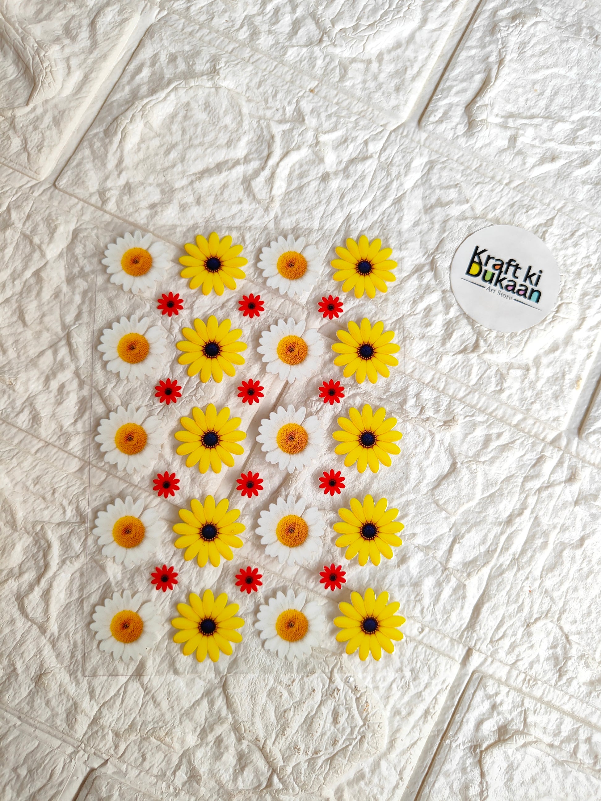 UV DTF peel-off sticker sheet with yellow daisy flowers and red accents, Krafti Udaan logo