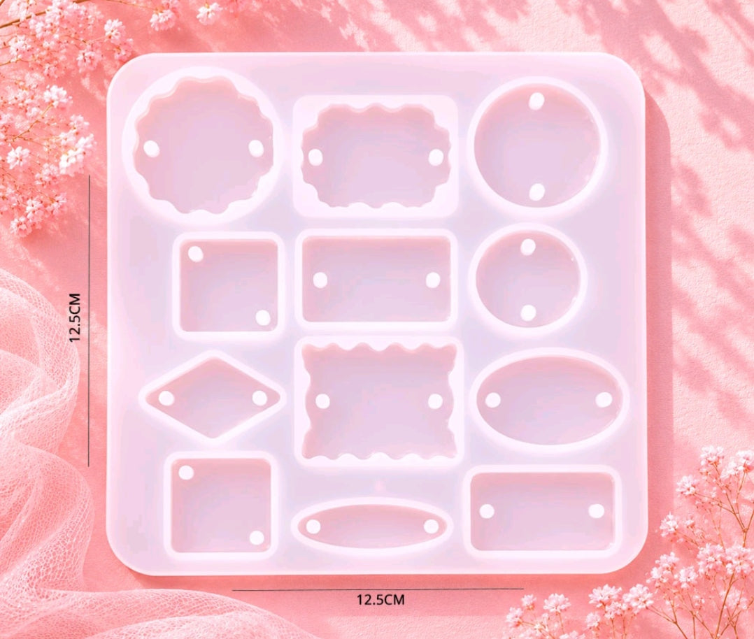 Pink 12-cavity rakhi mould tray with assorted circular and square cutouts