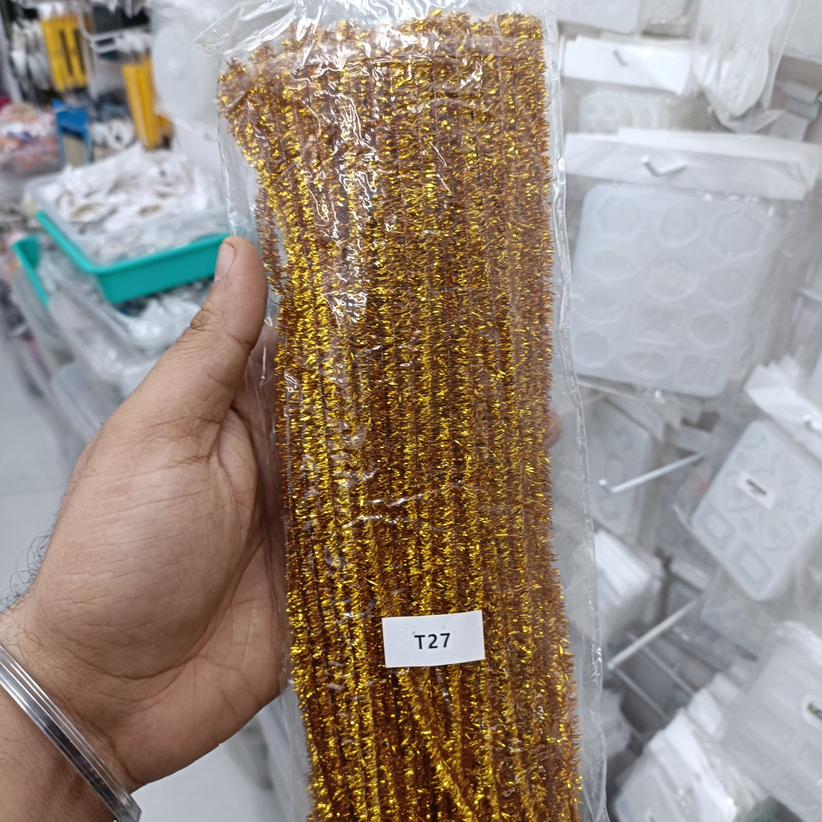 Gold sparkle pipe cleaner bundle with tight coil, pack of 100 in clear plastic
