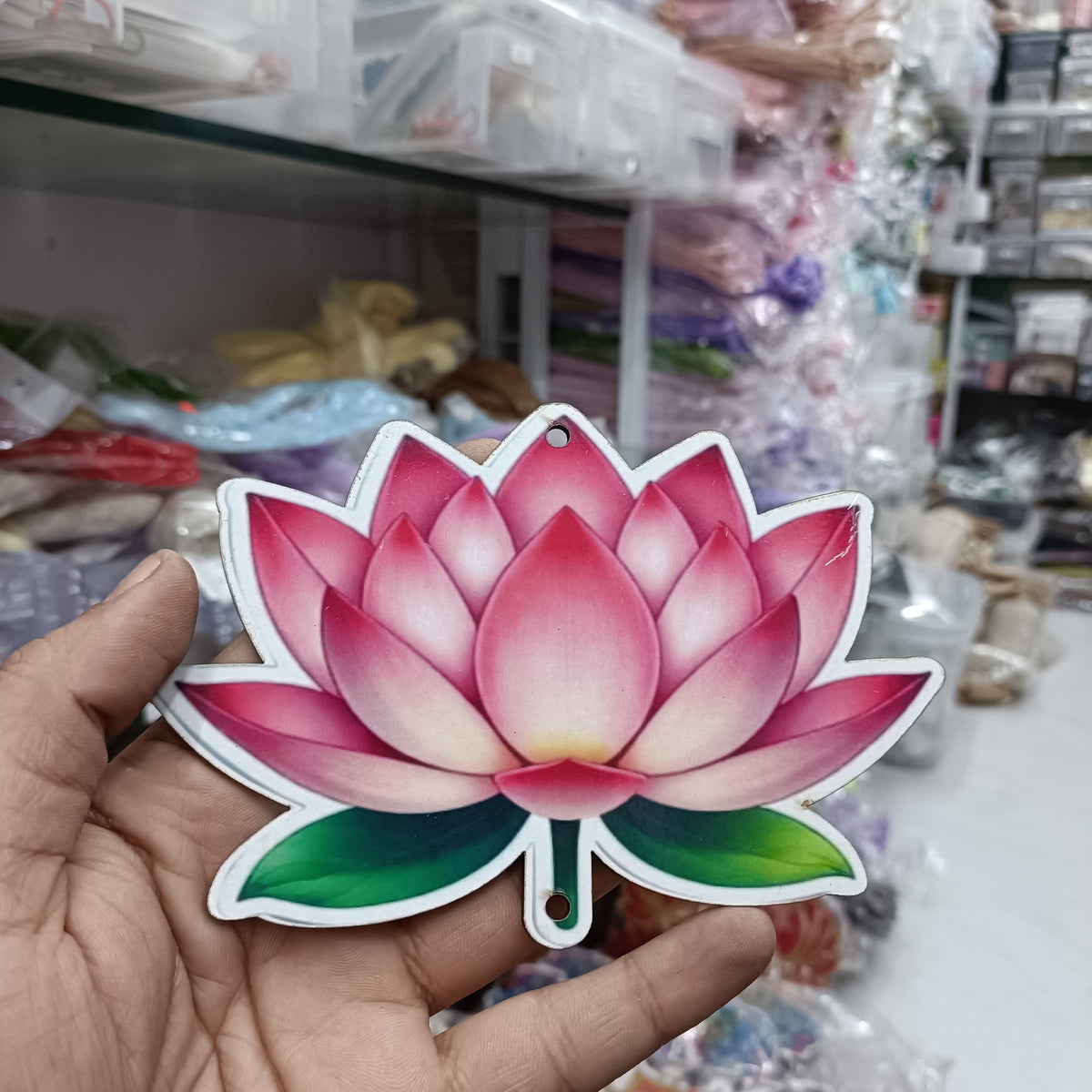 Lotus flower MDF cutout with pink layered petals, green leaves, hanging hole, held up