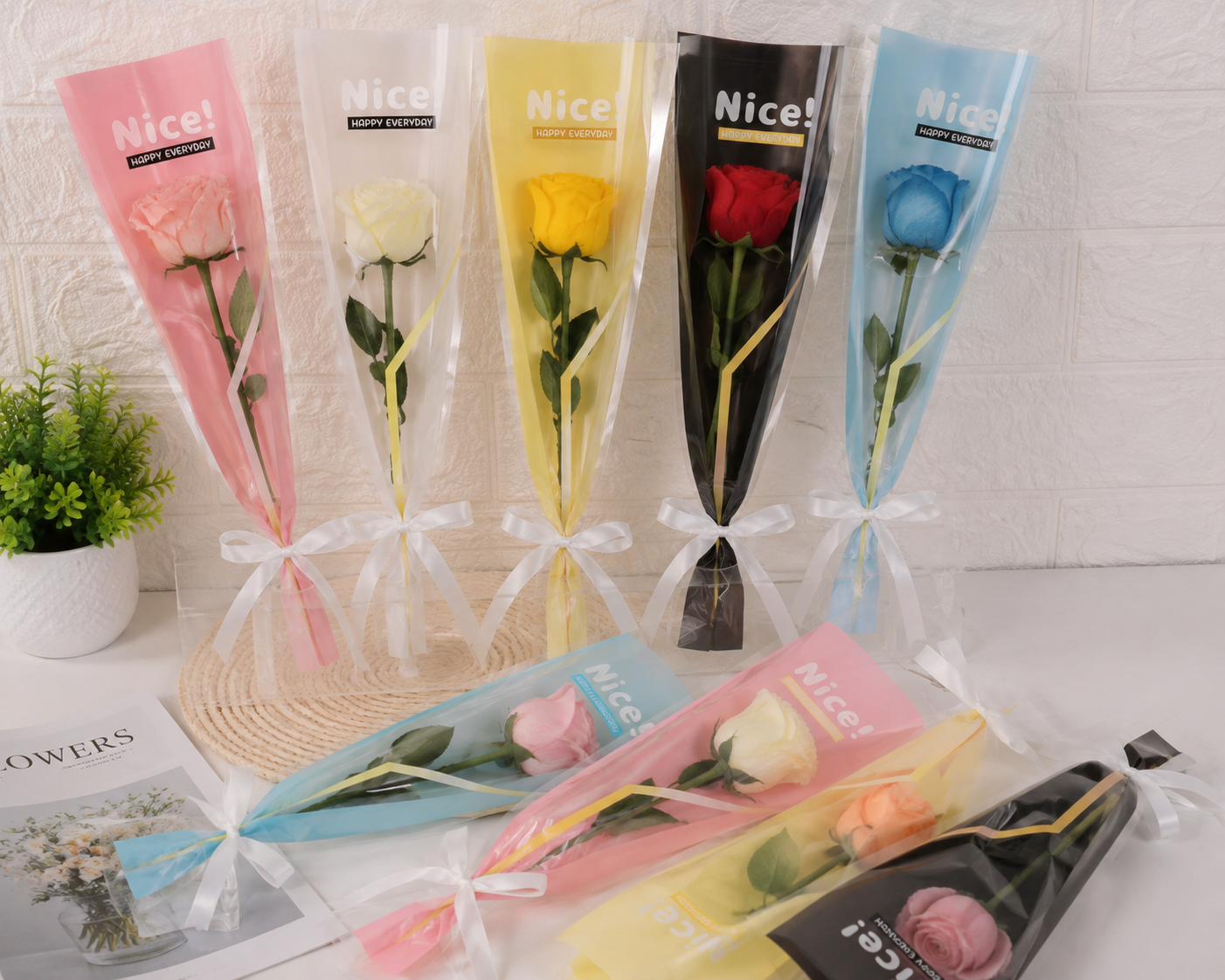 Set of flower cover sleeves with rose stems inside pastel pink, yellow, red, and blue packs