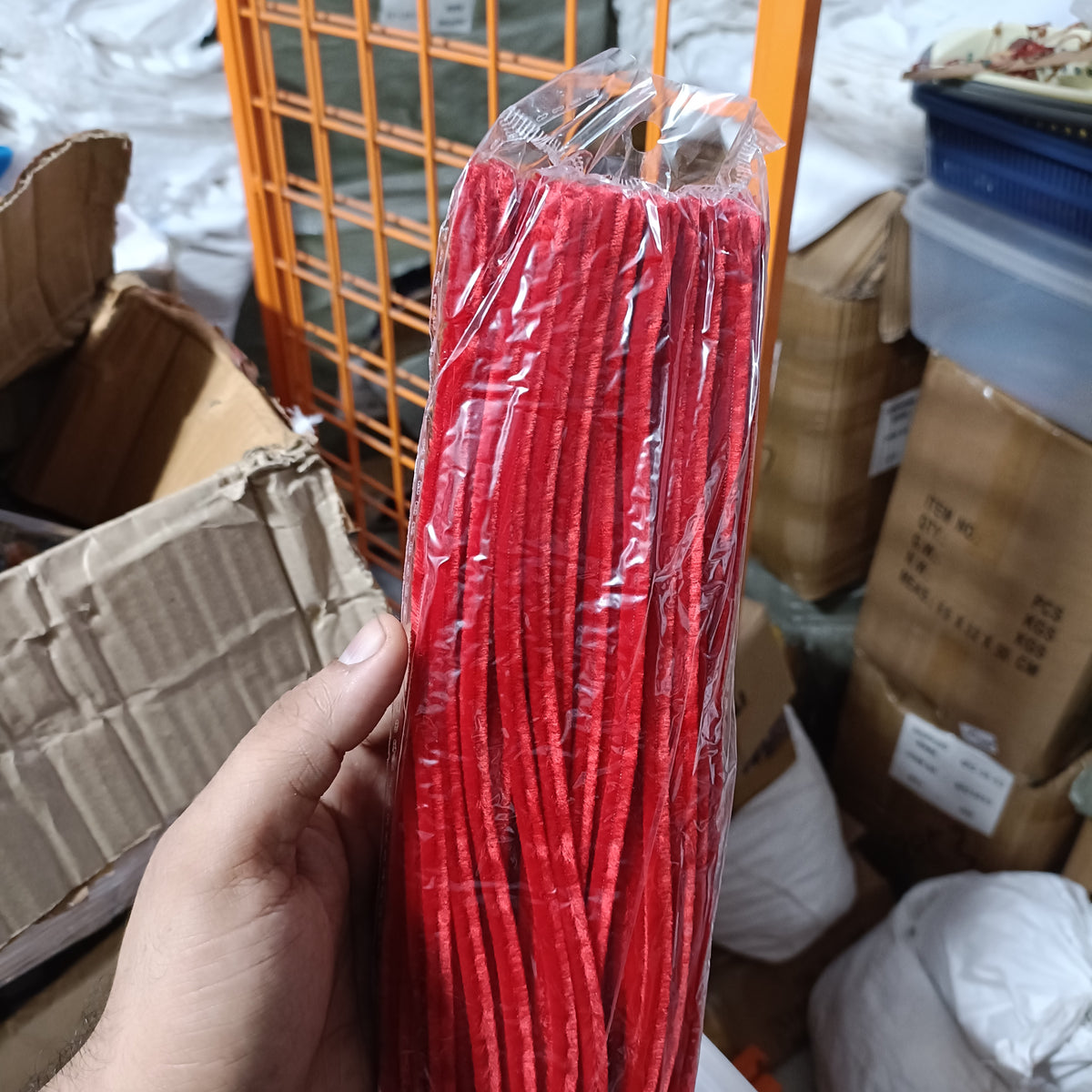 Red pipe cleaner bundle in clear plastic bag, twisted chenille sticks
