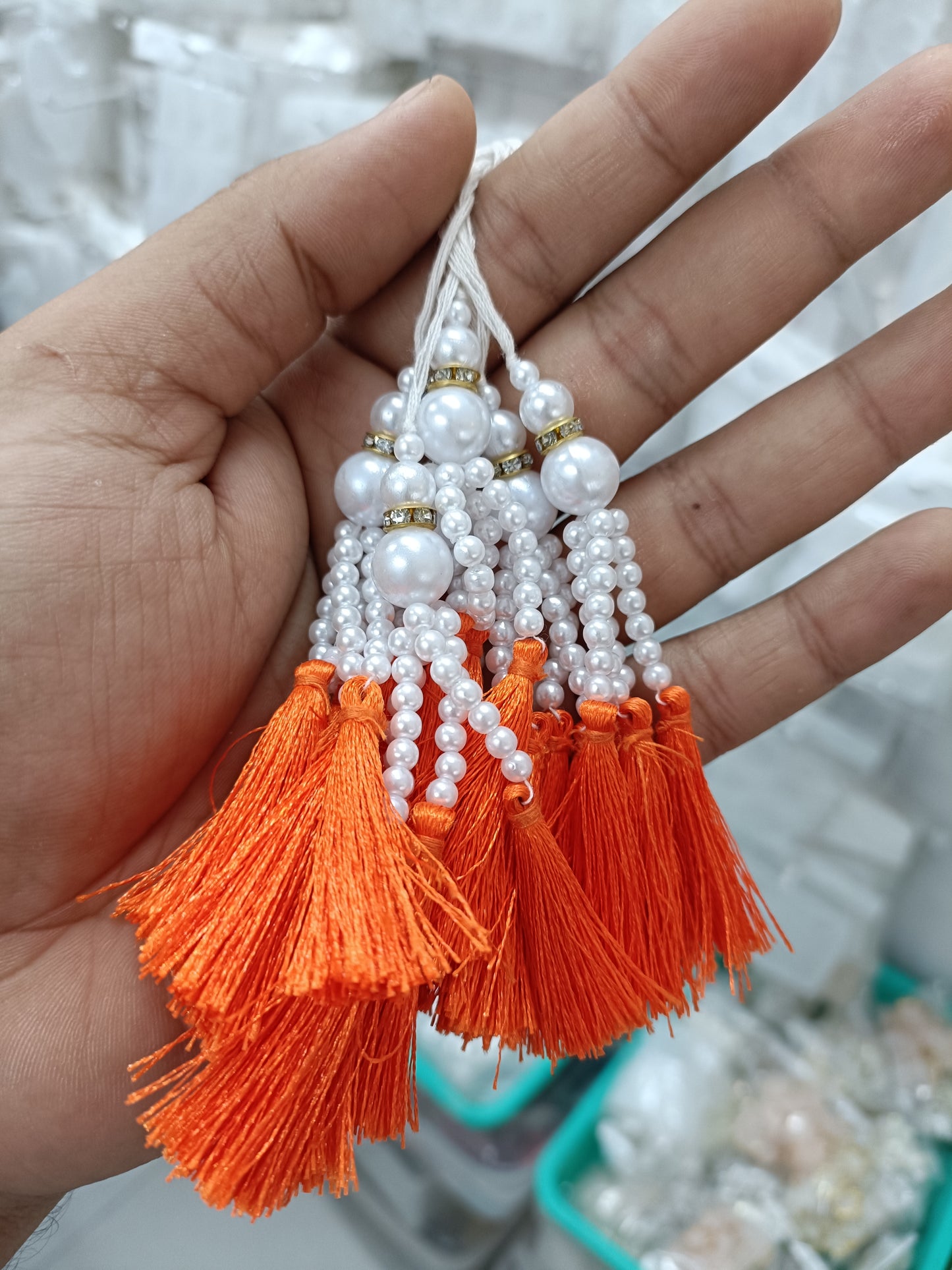 Beaded pearl latkan tassel bunch with orange silk tassels and white beaded drops