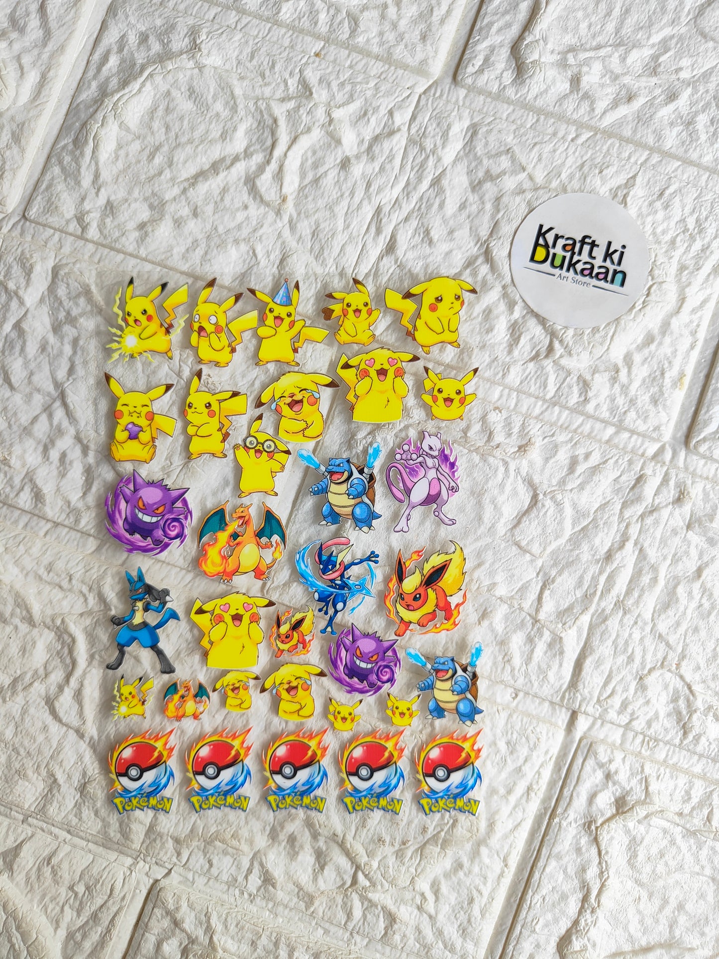 Peel-off sticker sheet with colorful cartoon monster designs, yellow and purple characters