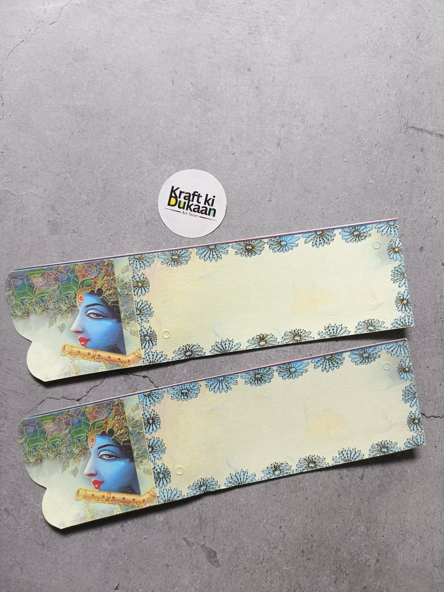 Rakhi card set with floral border and blue face portrait on left, two cards