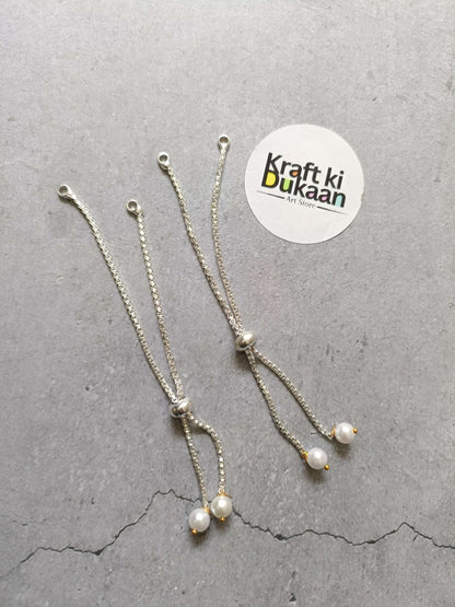Silver-tone chain bracelet with pearl drop charms and small clasp