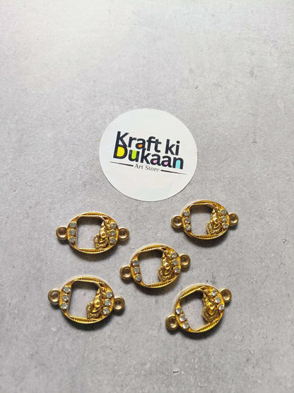 Five gold-tone oval rakhi bracelet bezels with rhinestones and side loops