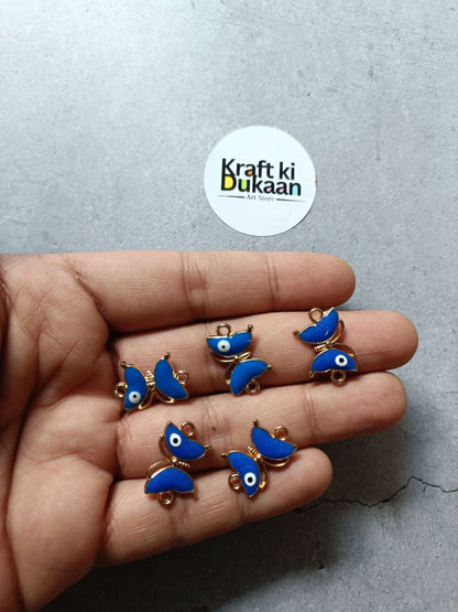 Blue enamel fish bracelet charms with gold-tone loops, small dangling eye detail