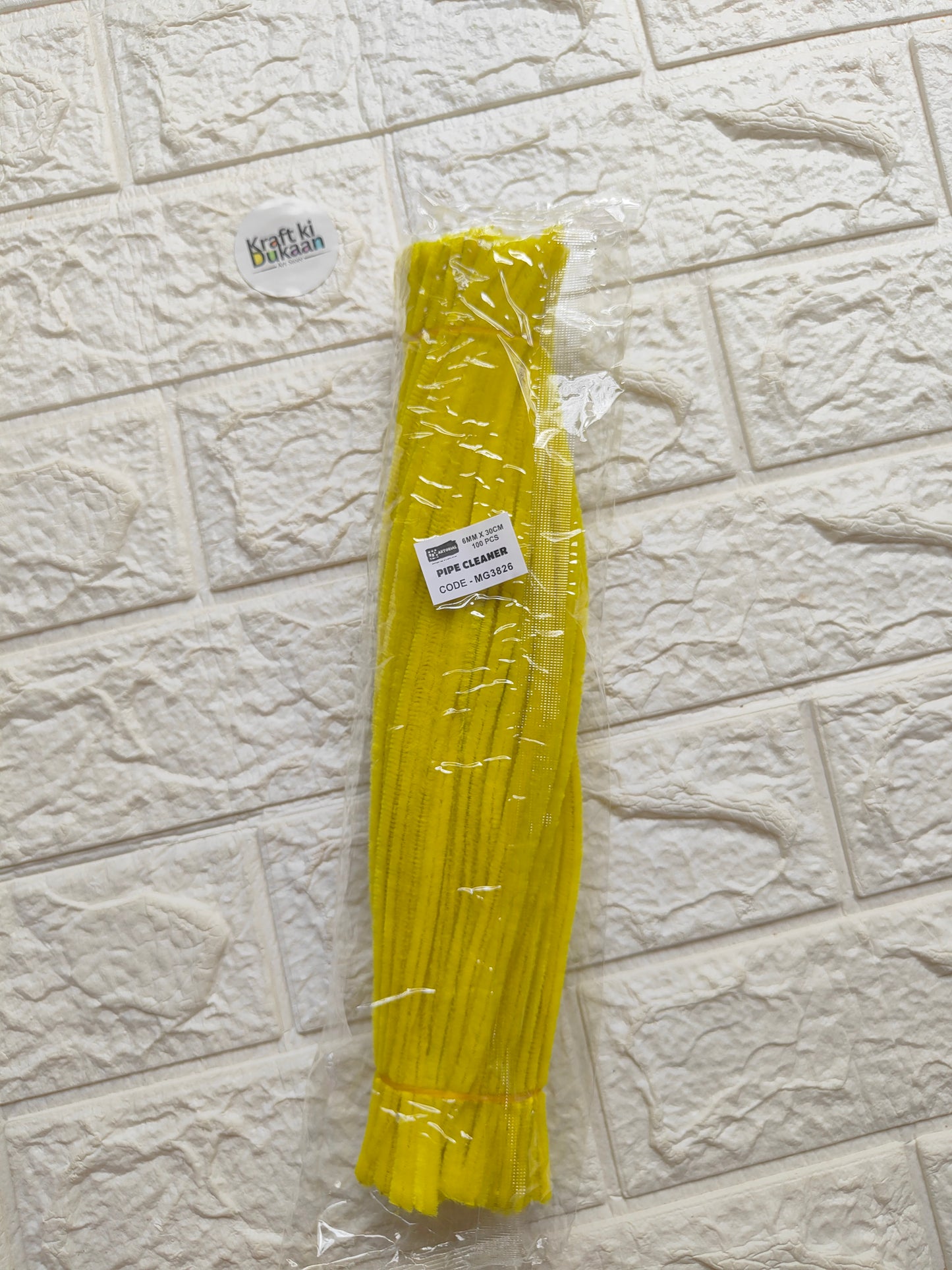 Yellow pipe cleaners in clear plastic pack, bundled twisty chenille craft sticks