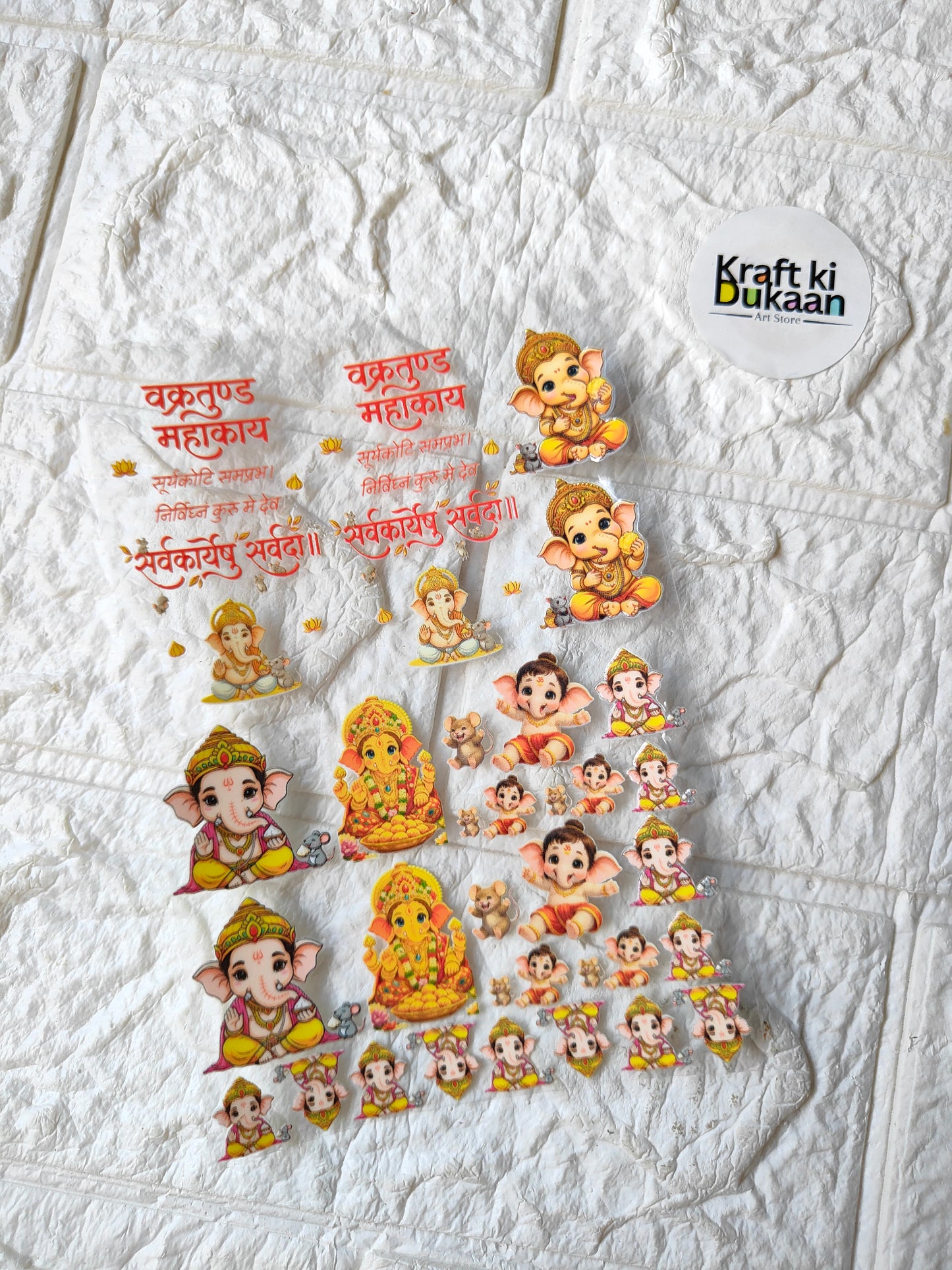 UV DTF peel-off sticker sheet with multiple cartoon child deity figures and red text
