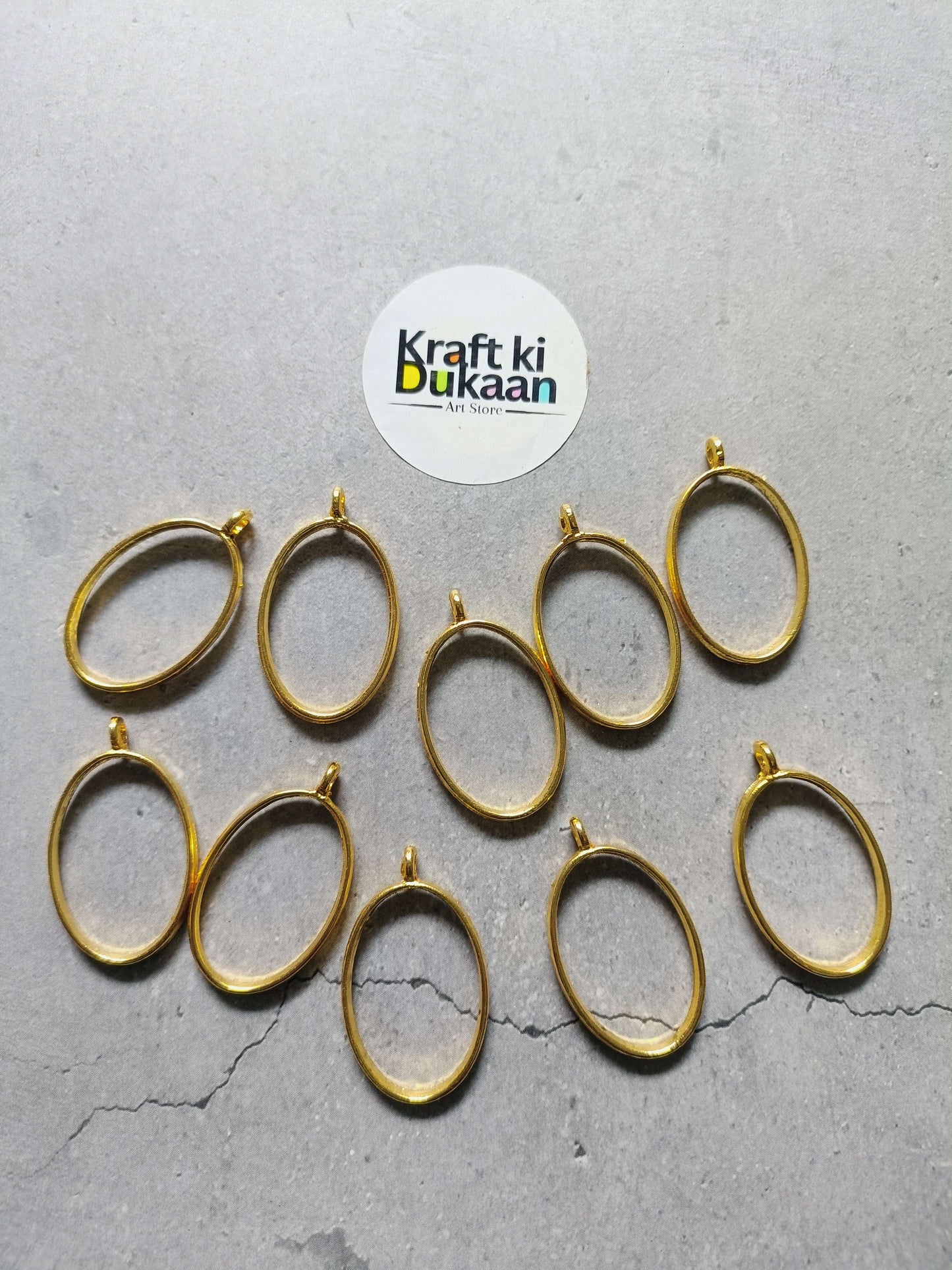 Gold oval bezel pendant set of 10, plain linked frames with small eye hooks