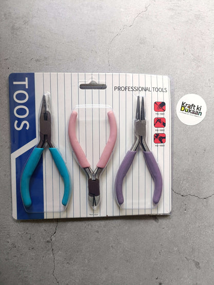 Three-piece pliers set: blue, pink, and purple handles on package card