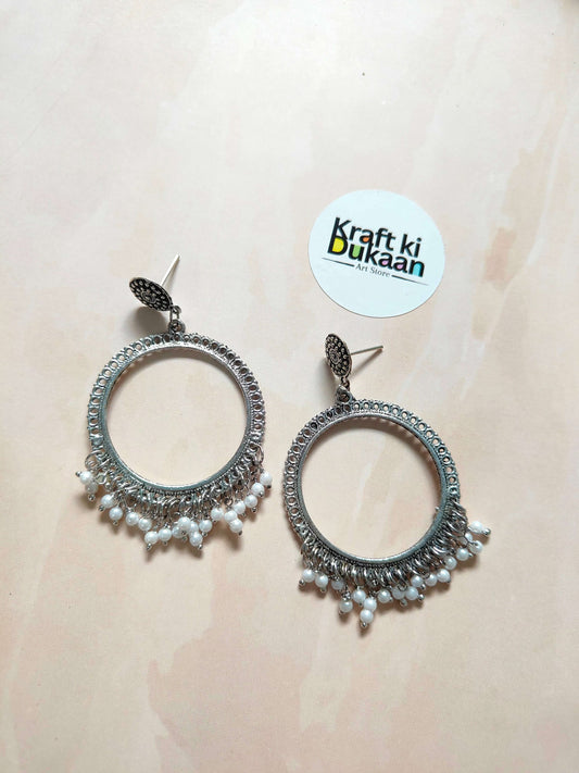 Silver jhumka earrings with dangling bead fringe and hoop-like round design (A56)