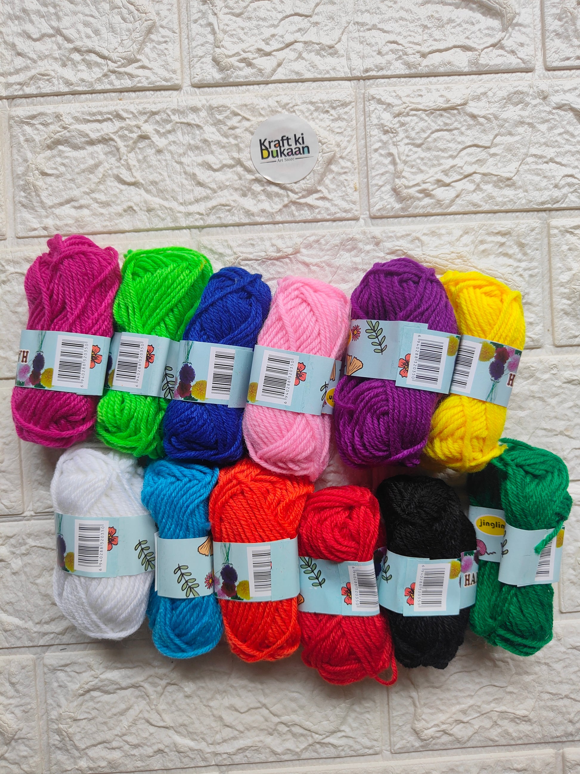 Woolen thread skeins in assorted colors: pink, green, blue, yellow, purple, black, red, white