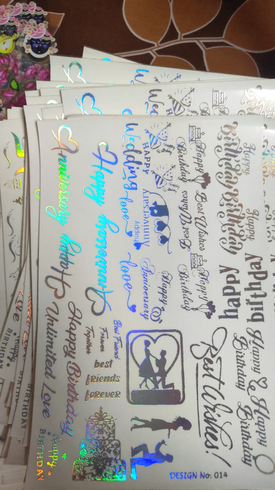 Holographic sticker sheet with assorted script designs and small icons