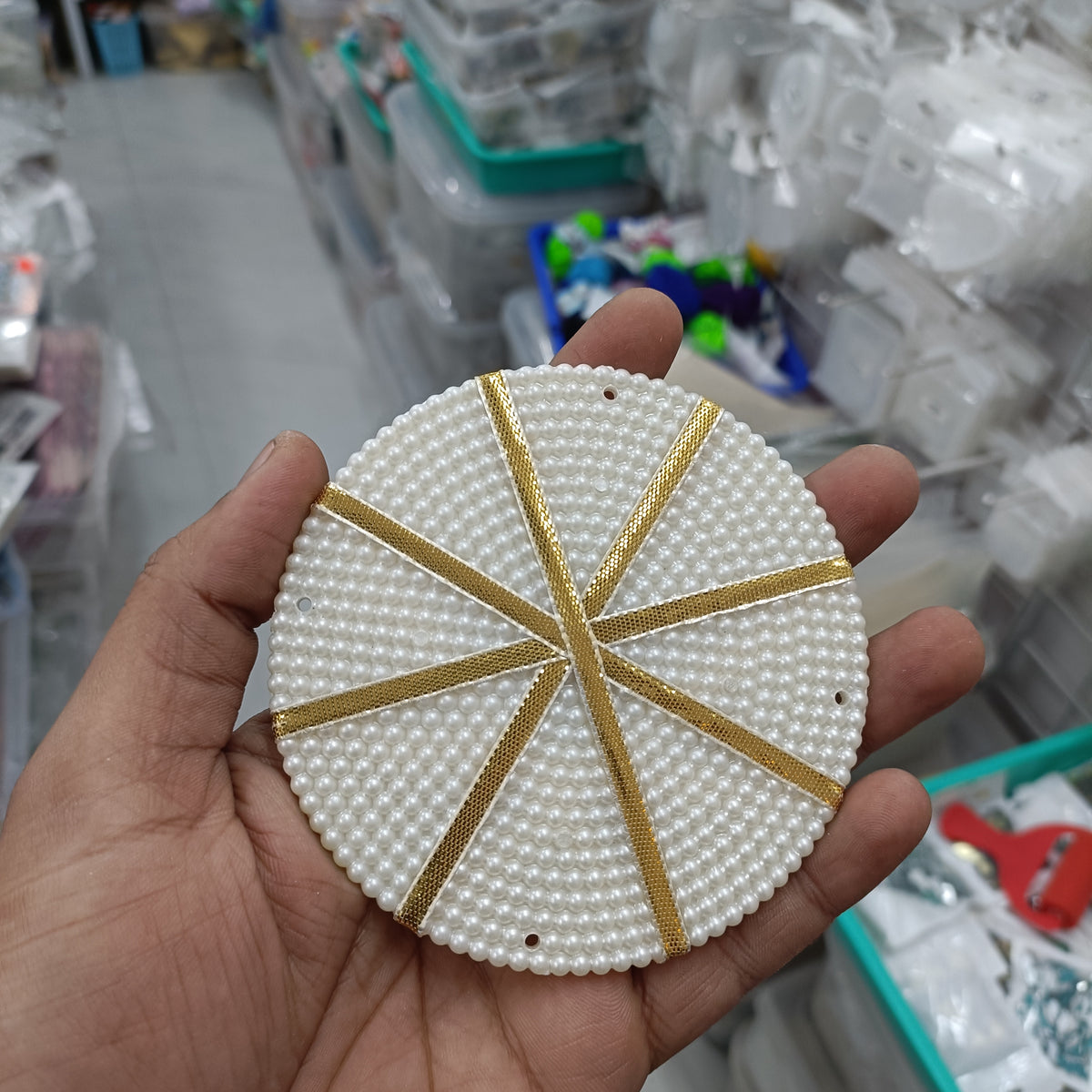 Round white beaded ring without center hole, with gold stripe detail