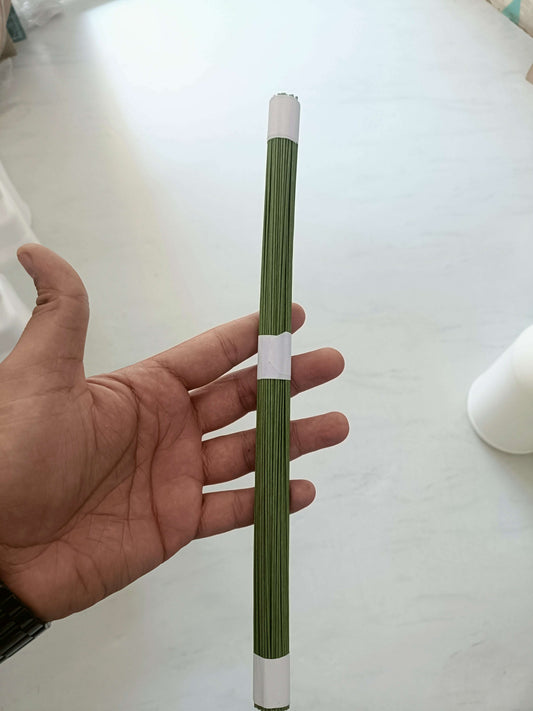 Green floral wire sticks, 12 in length, held in hand, with white wrapped base