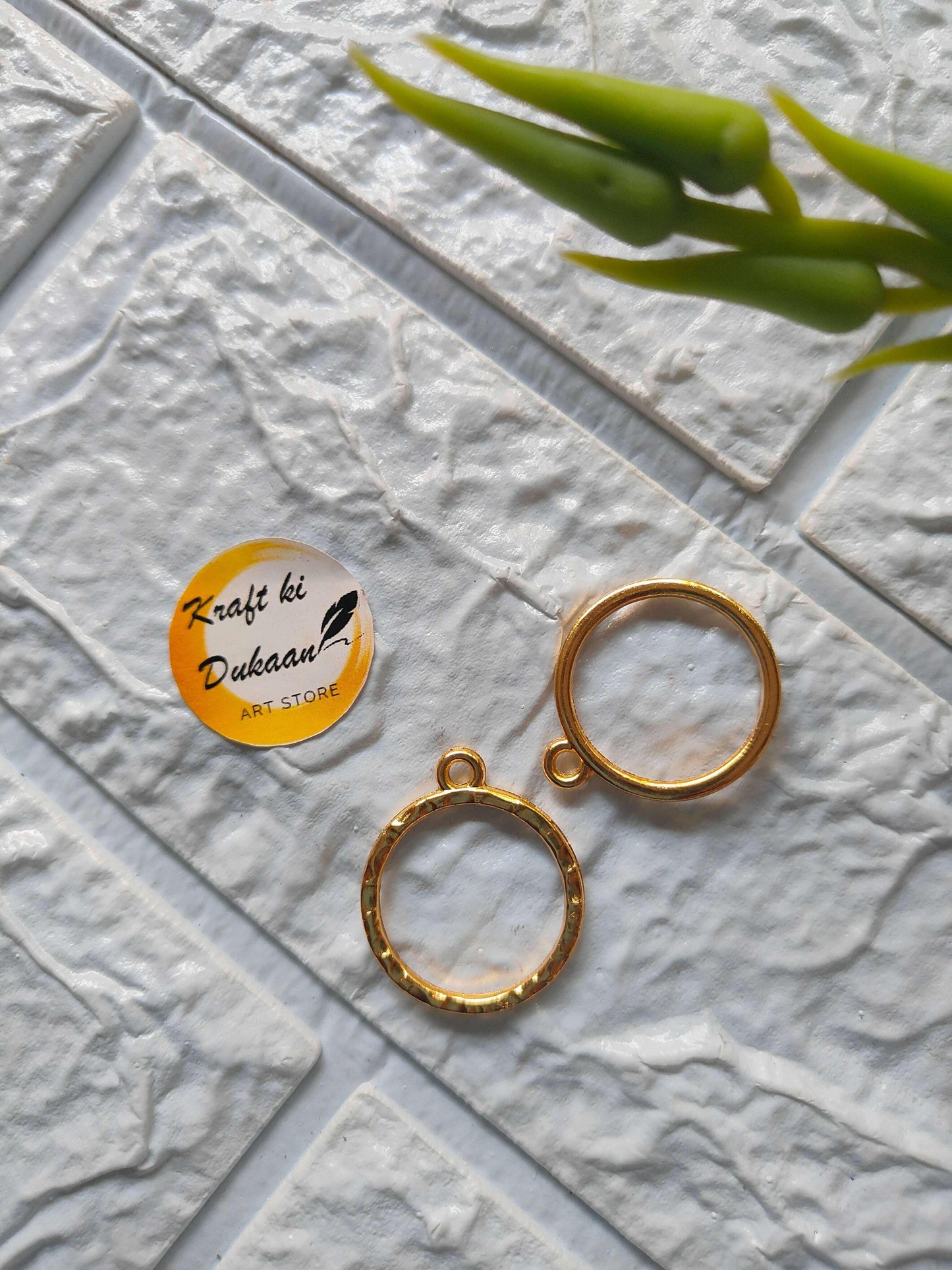 Round bezel pendant loops in gold tone, with small top eyelets