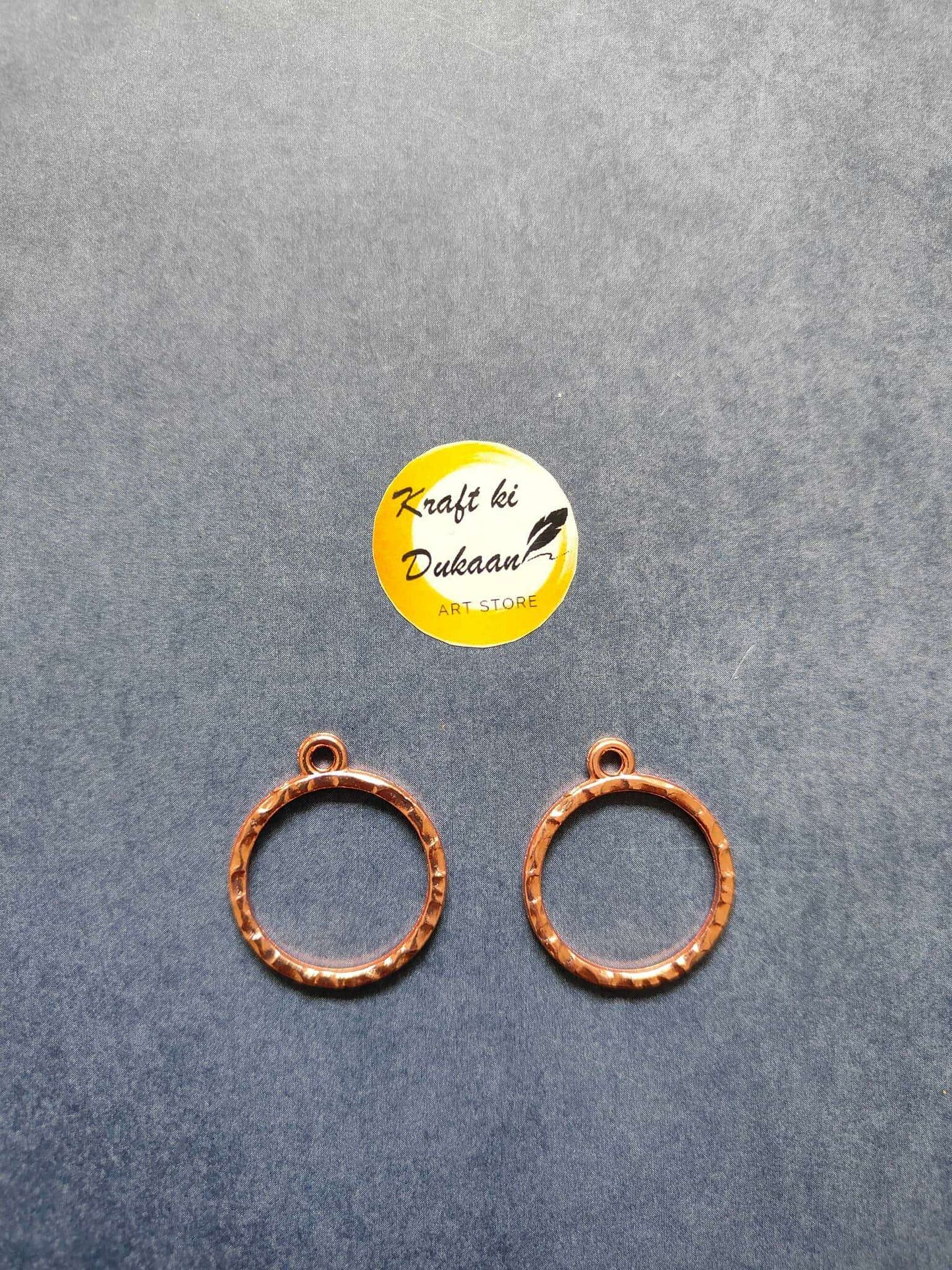 Rose gold round bezel pendant loops, two circular frames with eyelets