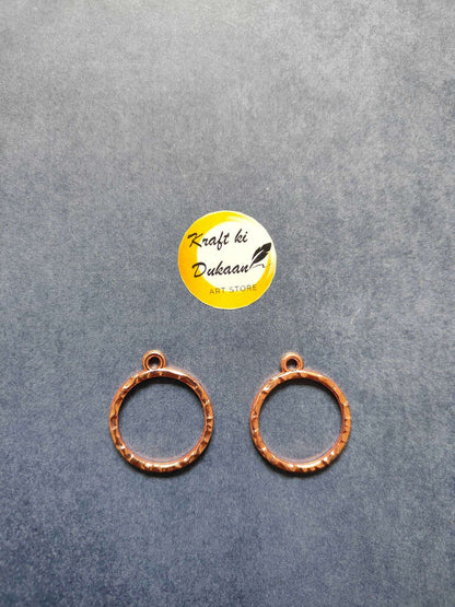 Rose gold round bezel pendant loops, two circular frames with eyelets