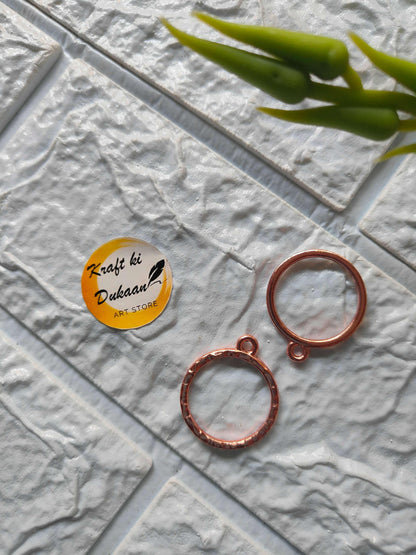Round bezel pendant loops in rose gold tone, with top eyelets