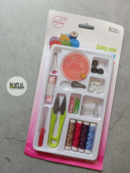 Sewing kit set in blister pack with scissors, needles, thread spools, safety pins.