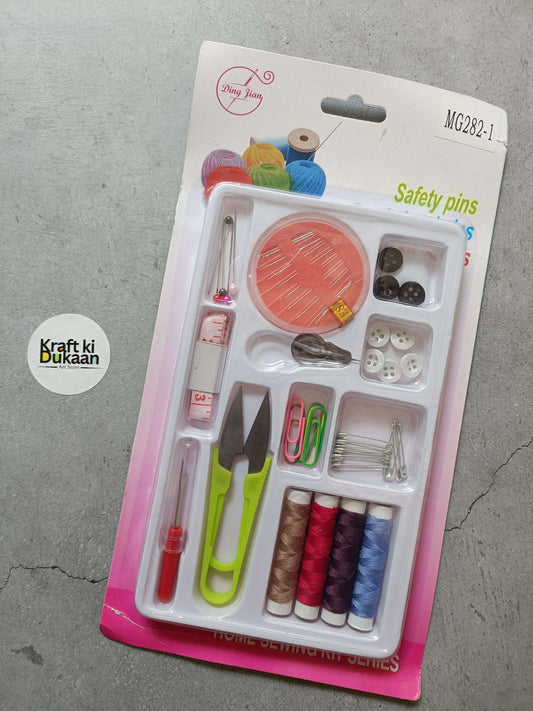 Sewing kit set in blister pack with scissors, needles, thread spools, safety pins.