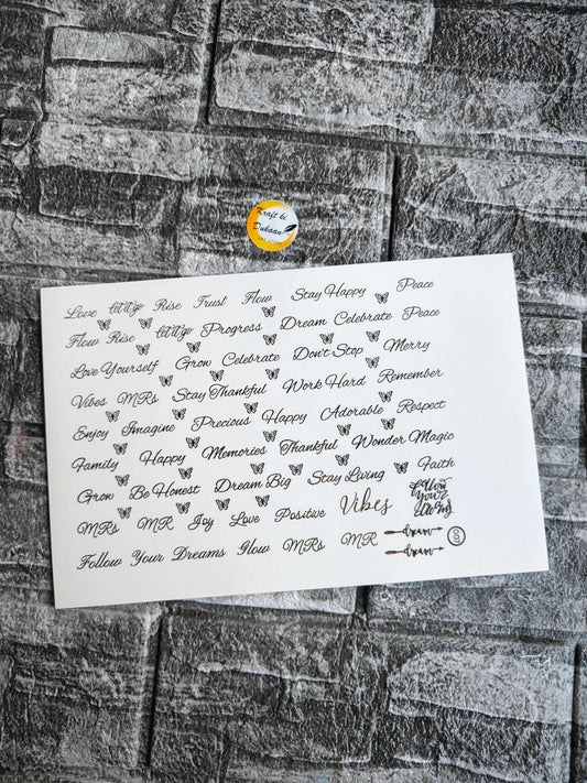 Gold embossed sticker sheet with many cursive word designs on white sheet