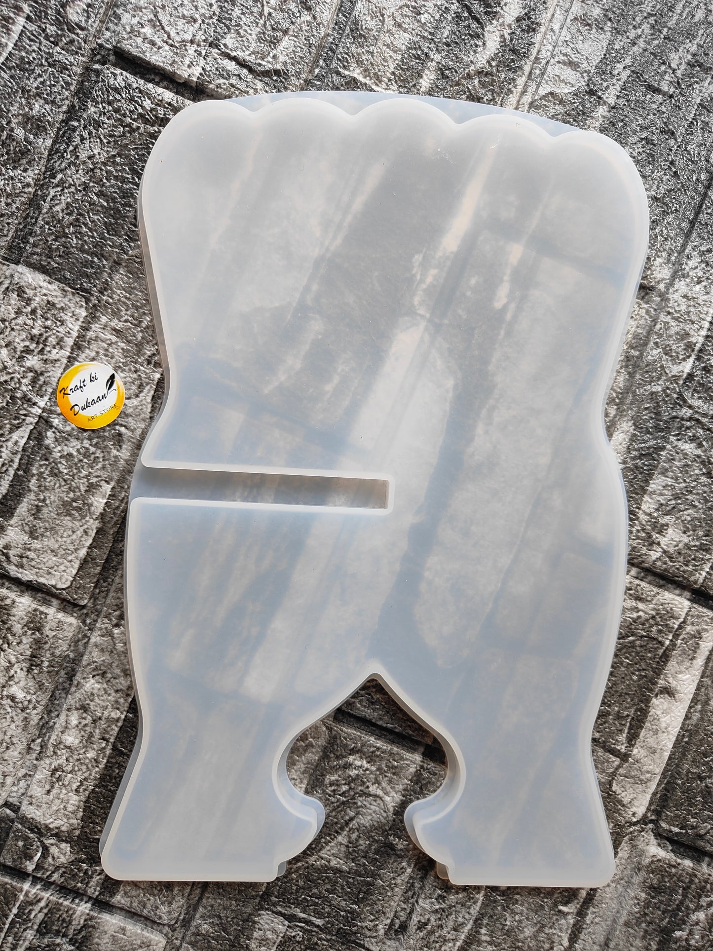 Transparent silicone book stand mold with slot for holding books upright on flat surface
