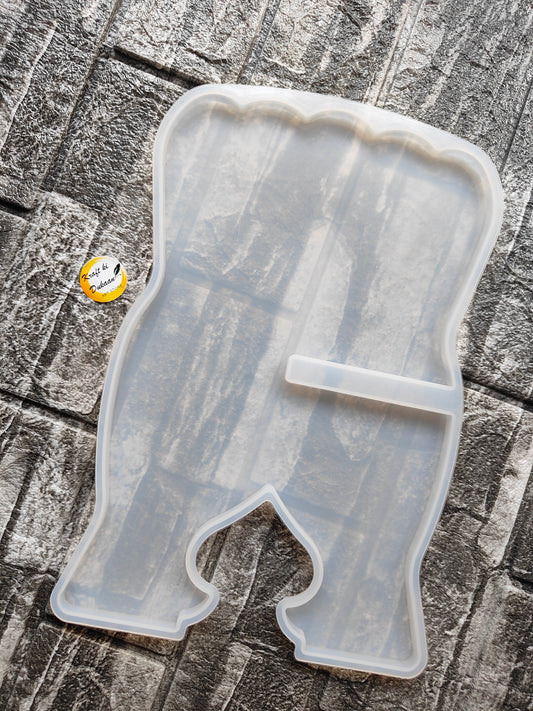 Transparent silicone book stand mold from Kraft ki Dukaan on textured stone surface