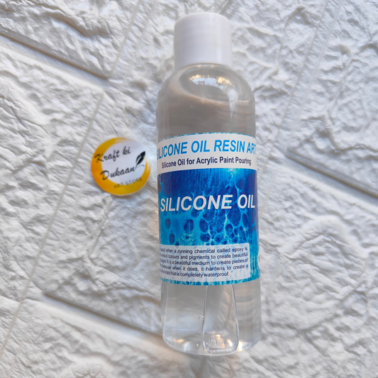 Kraft ki Dukaan silicone oil for resin art in a clear bottle for acrylic paint pouring