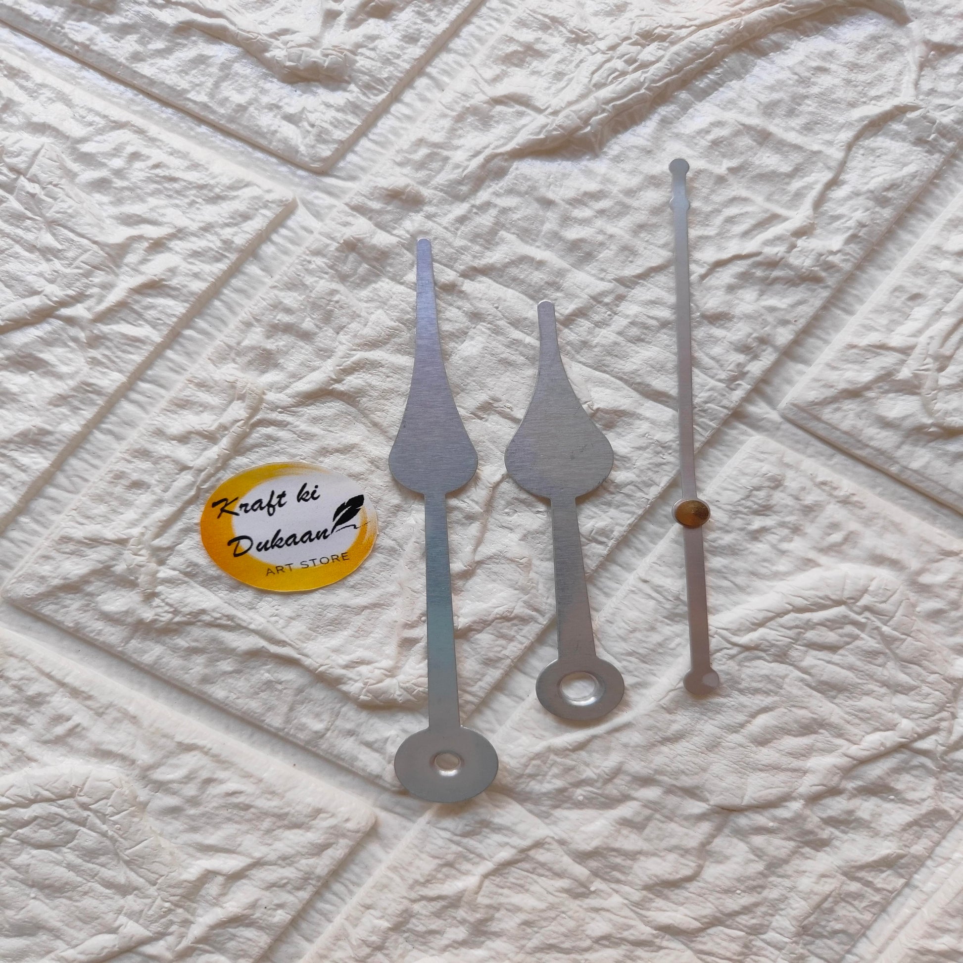 Silver clock hands replacement kit featuring three distinct styles for various clock designs