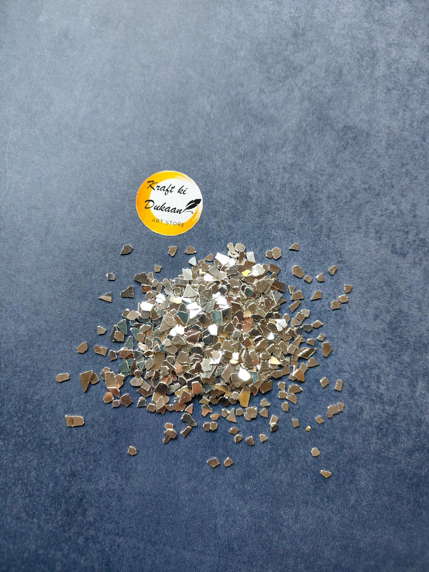 Silver crystal chips with small reflective square pieces scattered