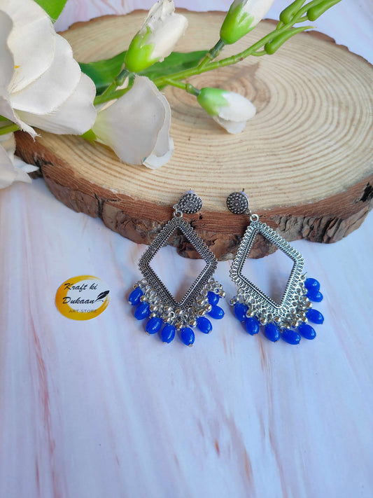 silver-jhumka-earrings-blue-bead-dangling-style