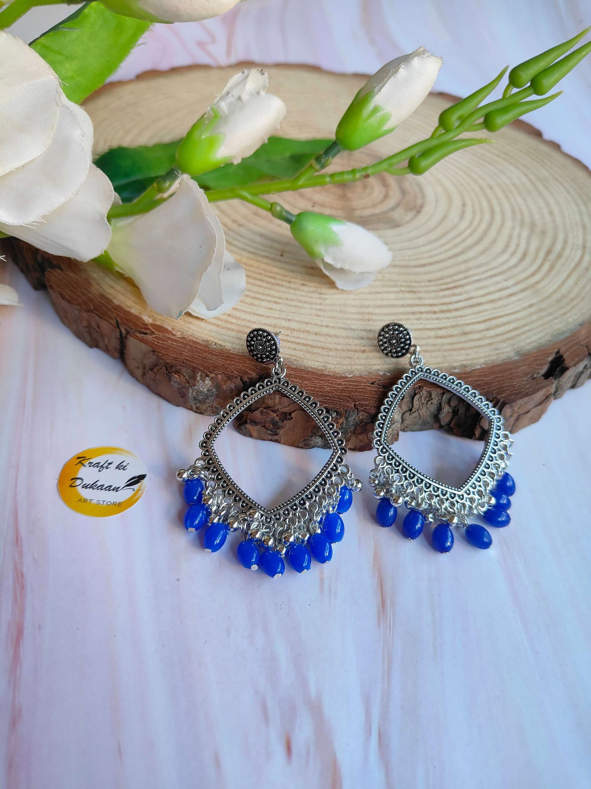 silver-jhumka-earrings-blue-bead-statement-pieces