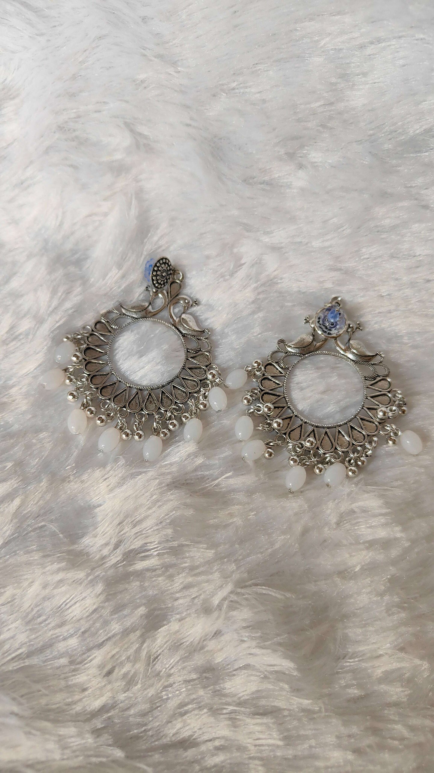 silver-jhumka-earrings-with-beads-angled-view