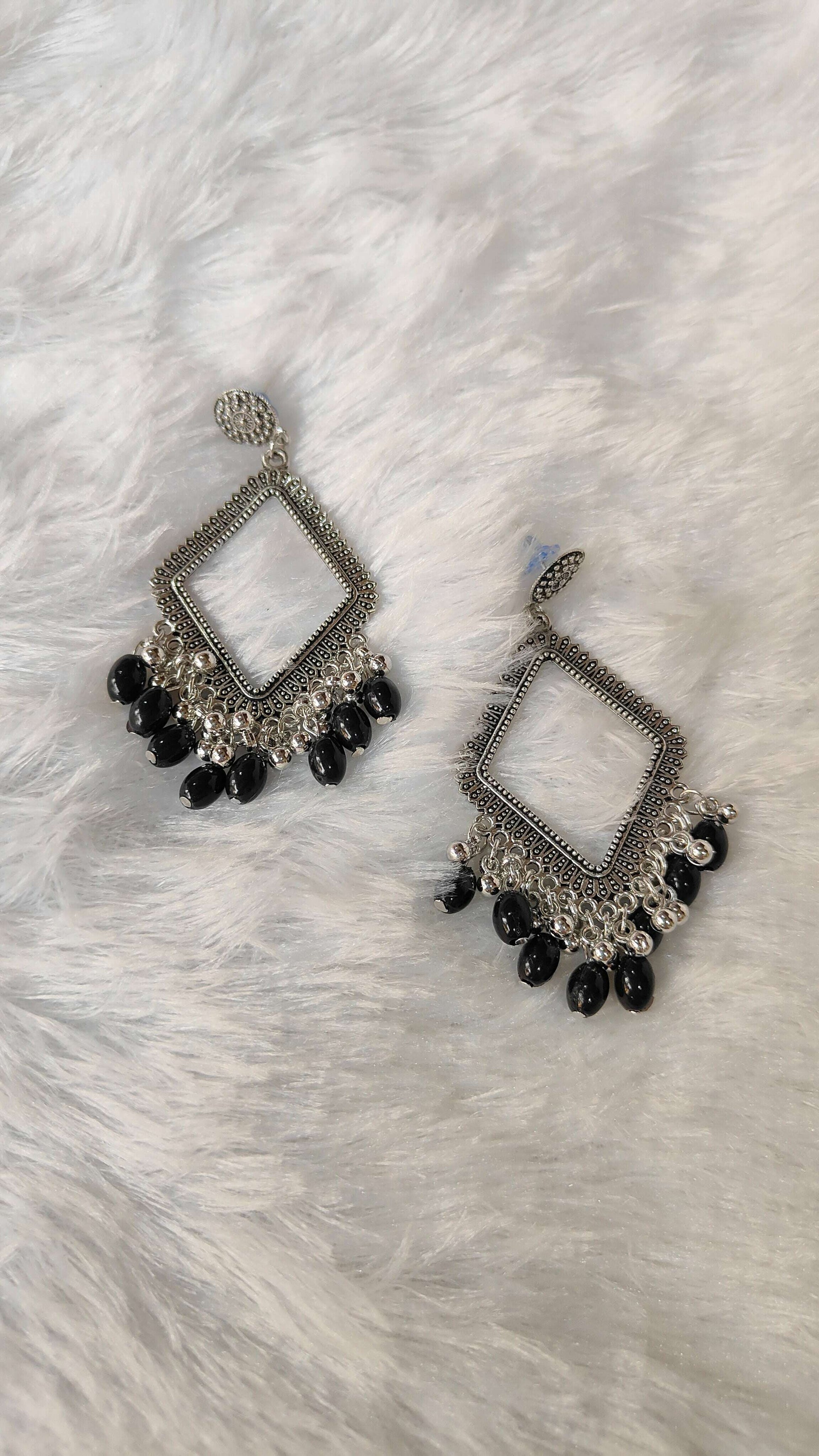 silver-jhumka-earrings-with-beads-black-dangle-design