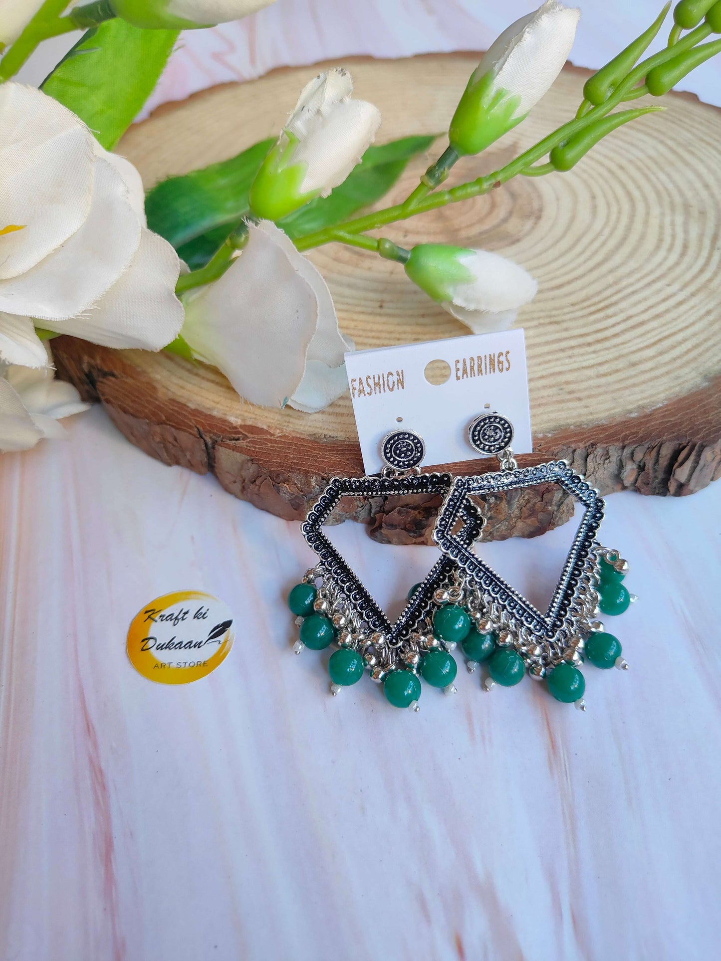 silver-jhumka-earrings-with-beads-green-beads-design