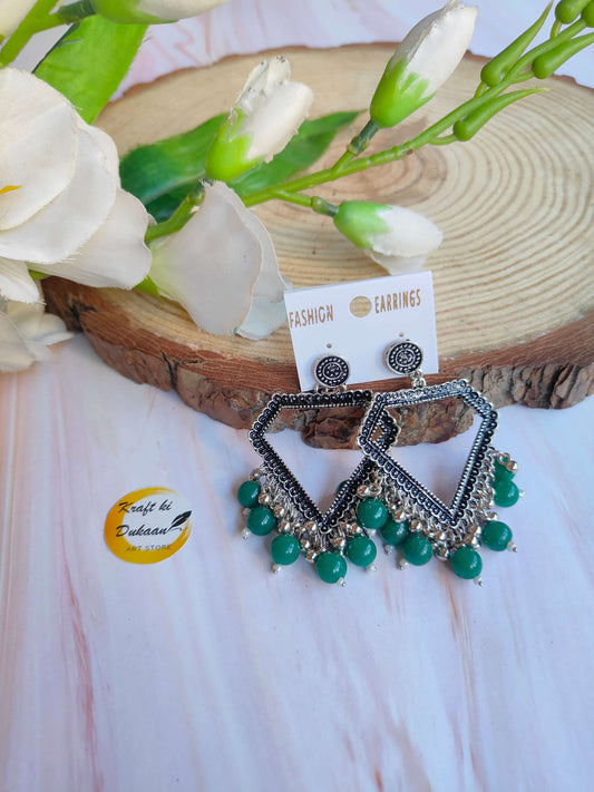 silver-jhumka-earrings-with-beads-green-beads-design