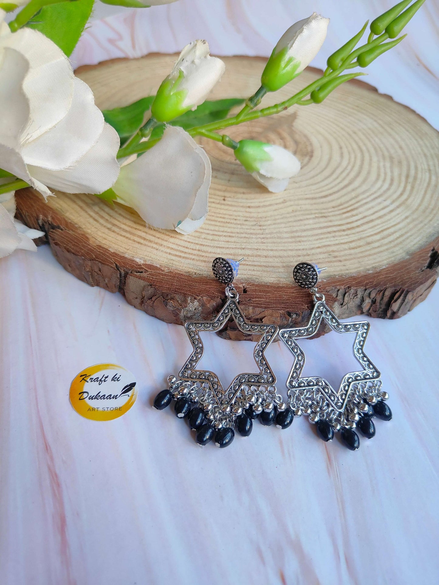 silver-jhumka-earrings-with-beads-star-design-black-beads