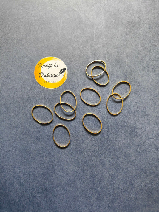 Oval bezel 10-piece set of gold-tone rings, multiple ring bands with oval bezels.