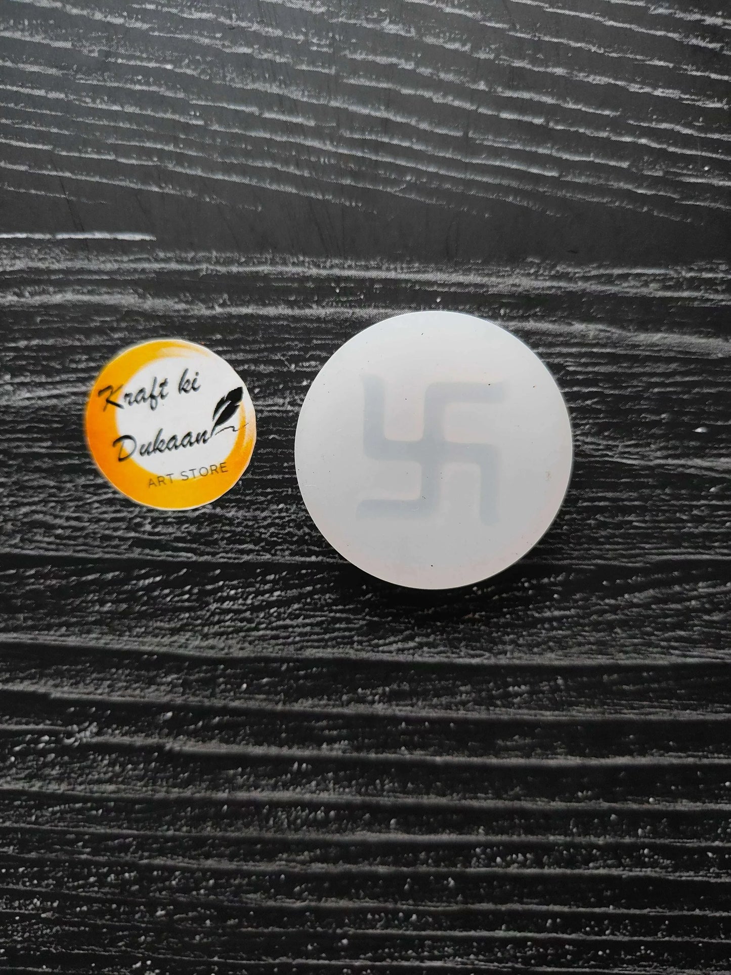 Round white swastik mould with swastika pattern on the center