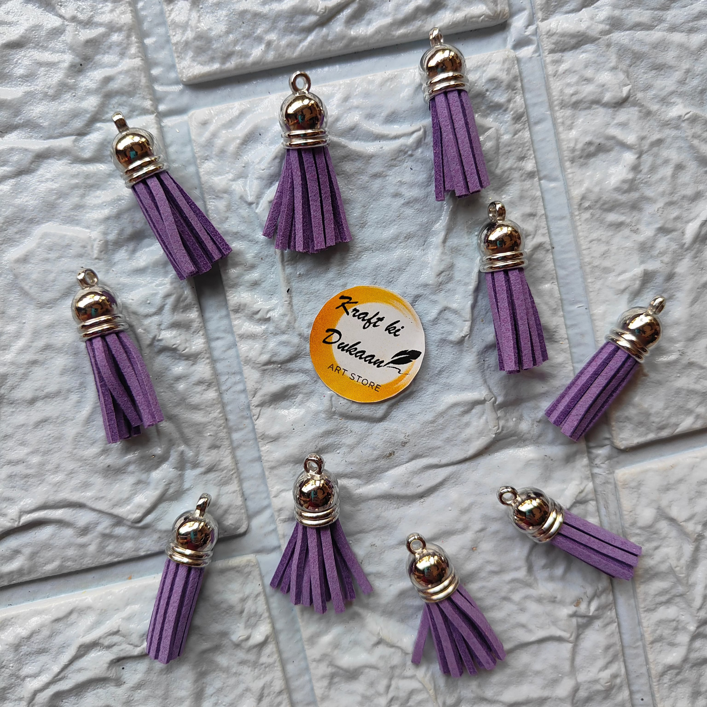 Set of purple and silver leather tassel charms for crafting and jewelry making