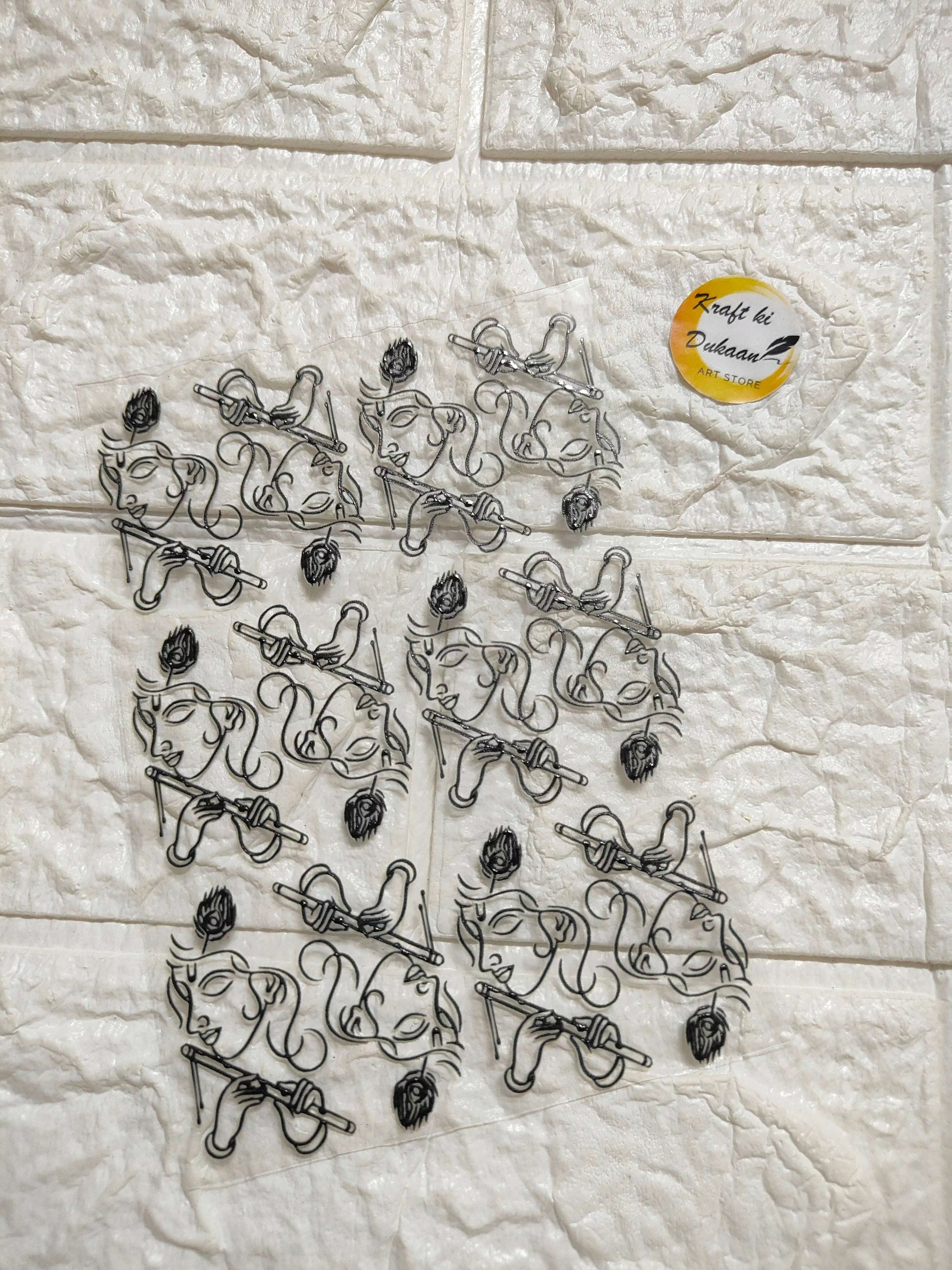 UV DTF peel-off sticker sheet J35 with black ornate trumpet-floral motifs
