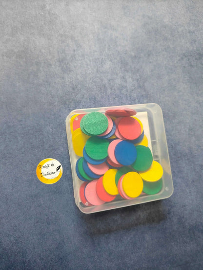 Craft wood coin set in clear box with multicolor coins, viewed from above